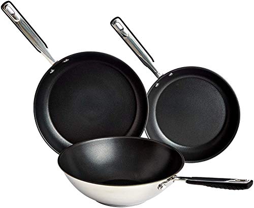 Juego de sartenes y wok de acero inoxidable con recubrimiento antiadherente en color negro, que incluye una sartén plana y un wok.