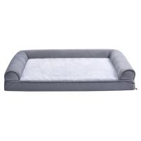 Cama-sofá para mascotas color gris con superficie blanca y laterales acolchados, ideal para perros