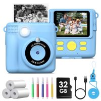 Cámara infantil instantánea en color azul con accesorios incluidos como rollos de impresión, lápices de colores y tarjeta de 32GB.