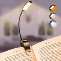 Luz de lectura Gritin encendida con distintos modos de luz sobre un libro